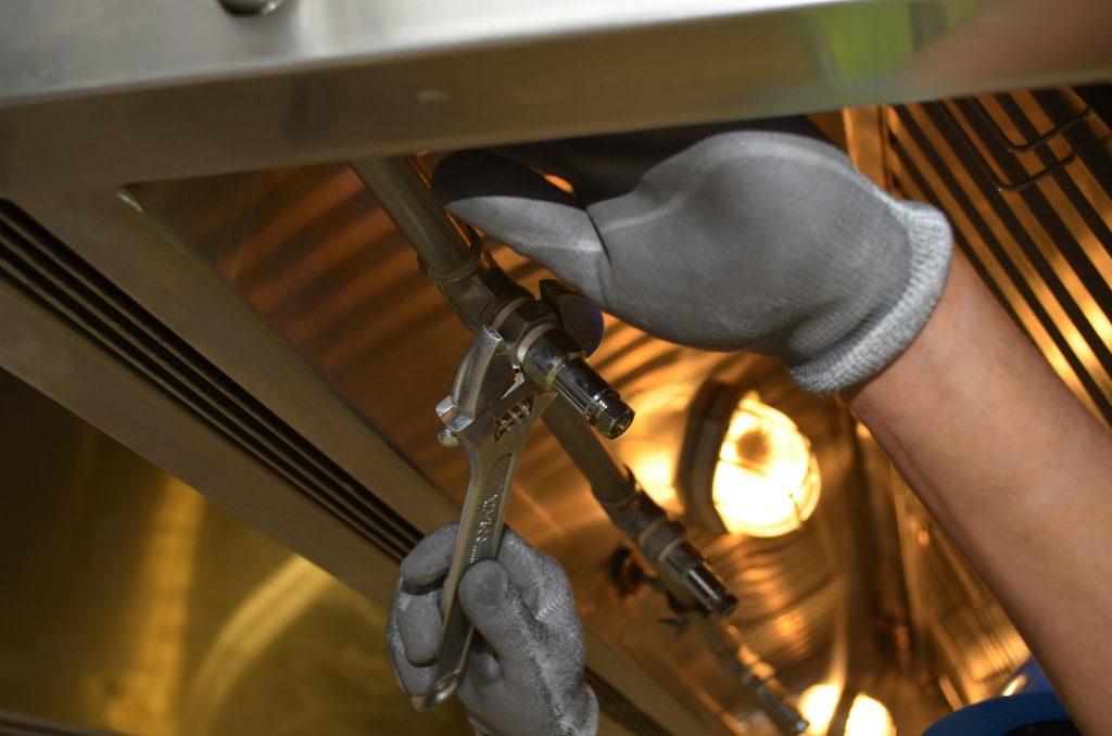 Close-up of Man Using a Spanner